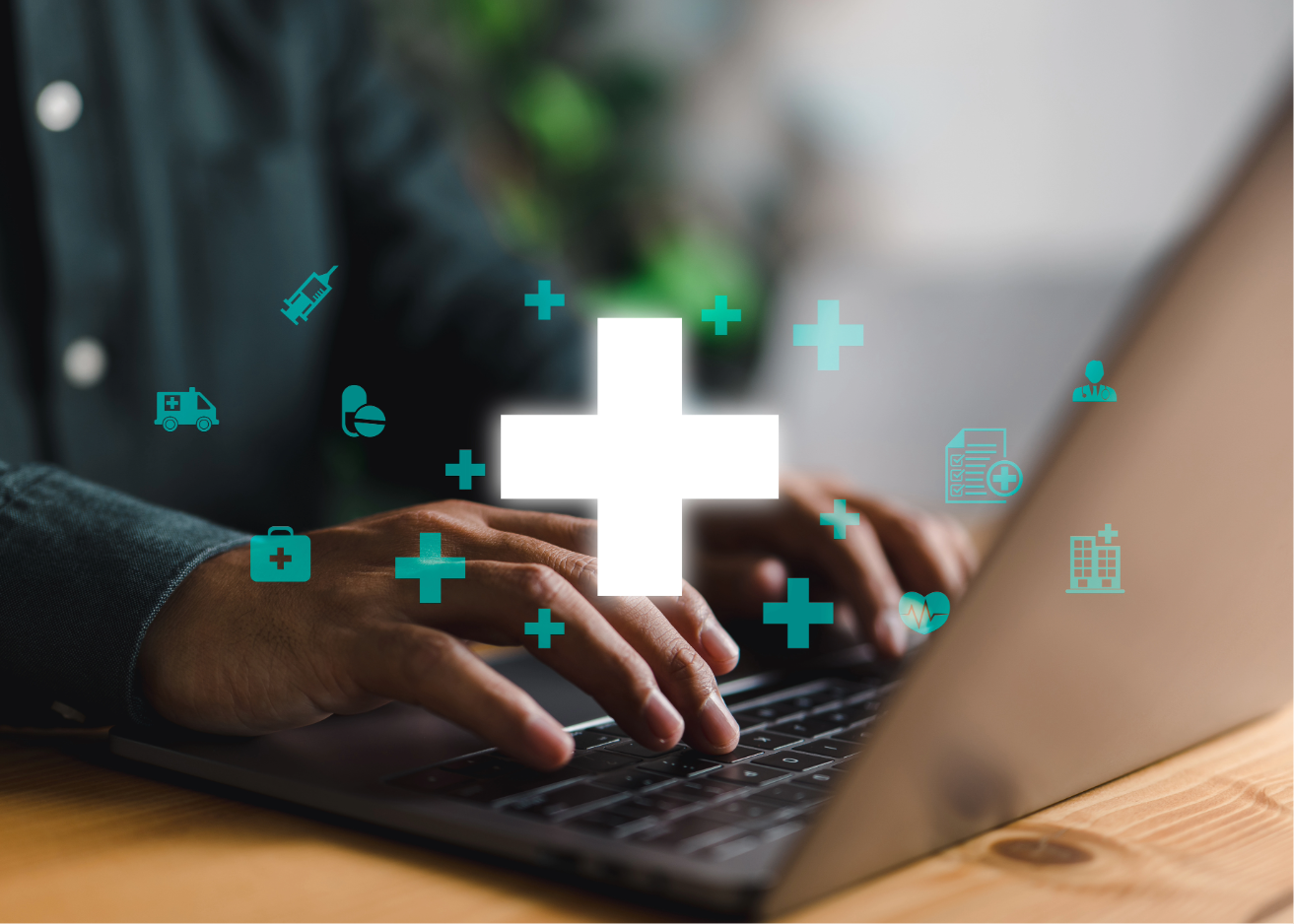 medical symbols over man at laptop